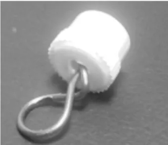 Figura 2. Tapón luer con dispositivo de anclaje de acero para pruebas de tracción.