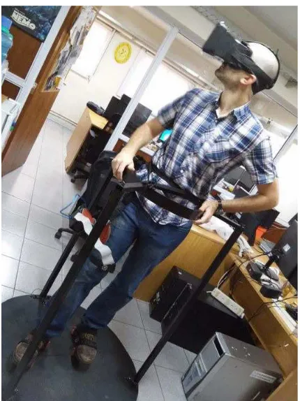 Figure 2: User on the omnidirectional platform.He iswearing a HMD running a Unity3d application on anAndroid tablet, and the Arduino Uno is attached to his leg.