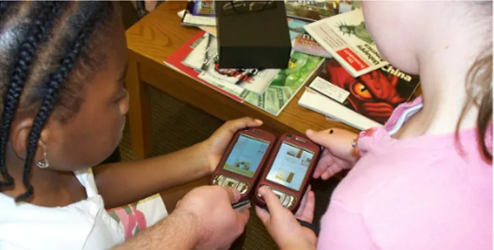 Figure 1. Children using Mobile Stories; bringing mobile  devices together to work collaboratively in a collocated 
