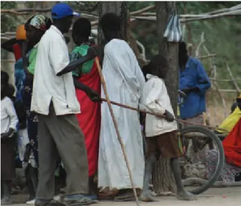 Figure  3.  “The  blind  leading  the  blind”  due  to  river  blindness  (onchocerciasis)  in  southern  Sudan