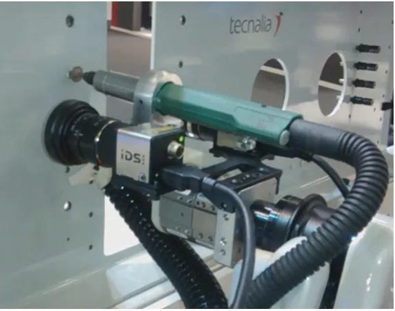 Figure 9. (a) The right arm of the robot is taking a rivet from a tray. (b) After taking the rivet it isintroduced in the previously detected drilled hole.