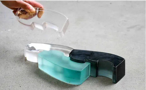 FIG. 7.12  Type D prototype made of clear glass, recycled float glass (teal) and recycled Cathode Ray Tube  (CRT) screen (black).