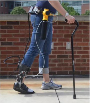 Figure 1.1: Portable Powered Ankle-Foot Orthosis  (PPAFO) with waist worn fuel tank and 