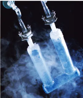 Figure c.9  Dark blue solid ozone inside a glass container  being remove from a tank of liquid nitrogen.
