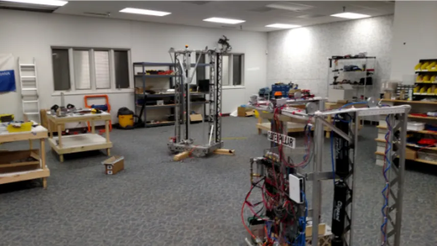 Figure 4. Two large FRC robots under construction by high school students in an adjacent room