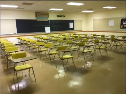 Figure 2. Active‐learning classroom space after the renovation  with movable tables, chairs, white‐boards, and dual projector  screens. 