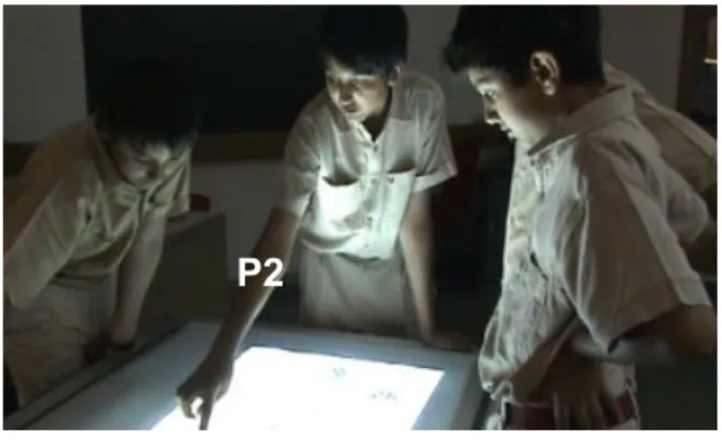 Fig. 2. P1 pointing at roots above the tabletop.