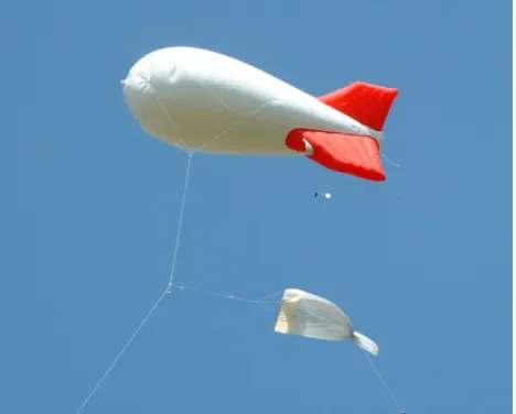 Fig. 1. Sampling insects at ca. 200 m above ground by means of a net attached to the tethering line of a 6-m long kytoon