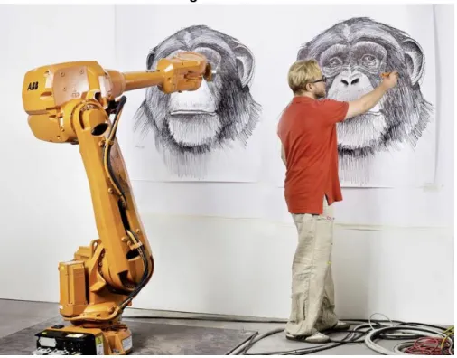 Figure 2. Alex Kiessling creating art while his strokes are sent to remote robots in real time