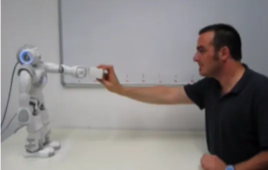 Figure 3.6: Experimental setup showing interaction between the Nao and a person.