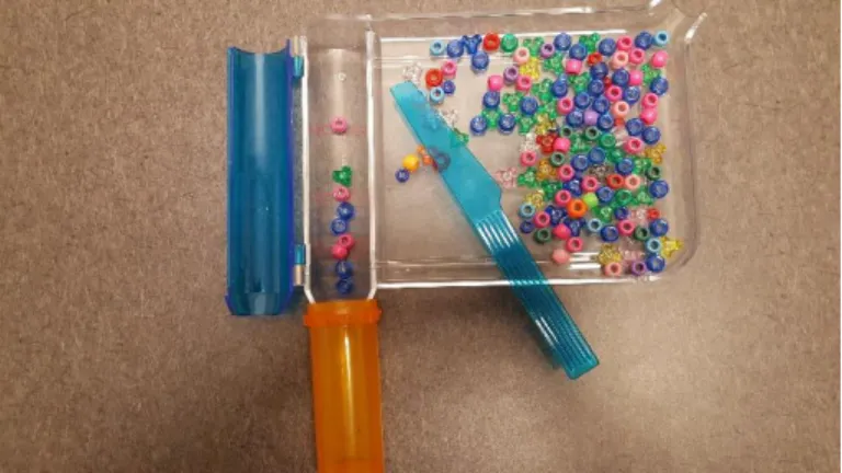 Figure 4: Arithmetic task set-up with manual pill counter, beads, and pill bottle 