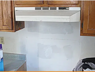 Figure 6  Drywall repairs behind a stove where mould   was growing