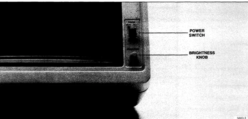 Figure 1-3 shows the front of the Display/CPU unit. Two controls are located at the front of the unit: the brightness control and the power switch