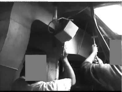 Figure 20.  Duct Workers Lowering Duct from Overhead