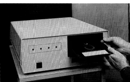 Figure 3-18. Placing disc in drive. 
