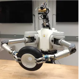 Figure 1.1: The DARPA ARM-S Robot. It consists of two arms are Barrett Technology 7-DOFWAM arms with a 6-DOF force sensor at each wrist