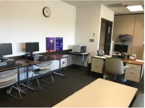 Figure 6: Student veteran worker’s desk creating a barrier between the door and  computers