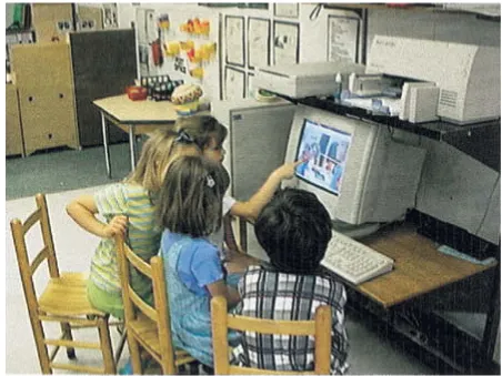 Fig. 2. Children use the computer to revisit a prior activity during a group discussion.