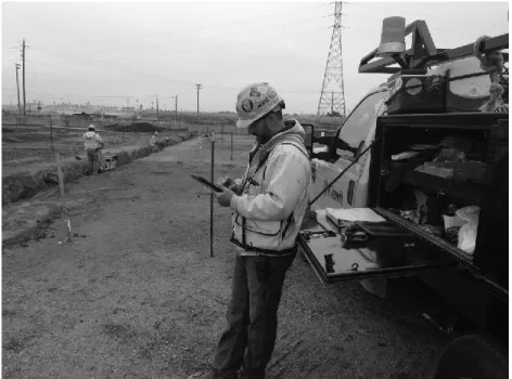 Figure 5: Foreman Using Tablet and Electronic Plan Table to Upload Timecard and Toolbox Report 