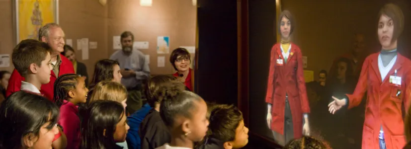 Figure 1.1: �e twins talking with a group of children in the Museum of Science, Boston.