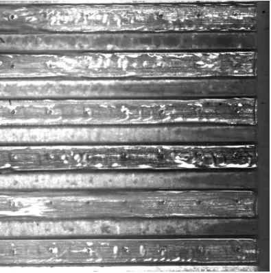 Figure 10.43e  Before CHF condition.  Successive frames from Figs. 10.43a to h taken at 2.0 ms time intervals illustrating contact of liquid with channel wall near the outlet in a set of six parallel horizontal microchannels