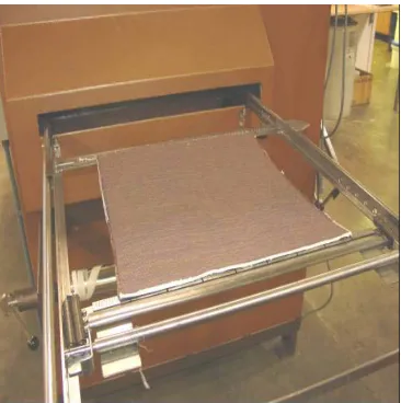 Figure 4. 11: Fabric pinned to the frame enters the heat-setting unit 