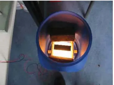 Figure 4.3: The setup used for obtaining images. A camera is placed above the barrel facingthe partial covered light
