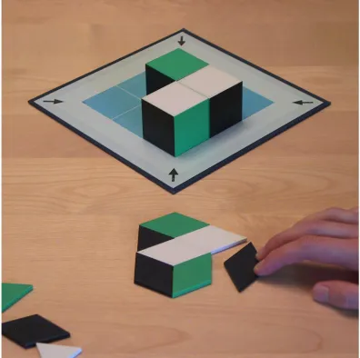 Figure 1. The Tridio® learning material, consisting of cubes, mosaic pieces and a board