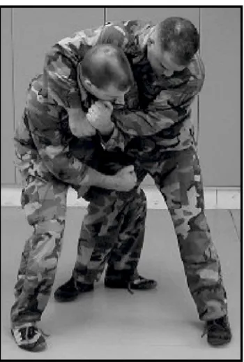 Figure 8-7. Defense against the bear hug from the rear, over the arms(continued).