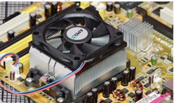 Fig. 2: A fan-cooled heat sink on the processor of a personal computer. To the right is a smaller heat sink cooling another integrated  circuit of the motherboard