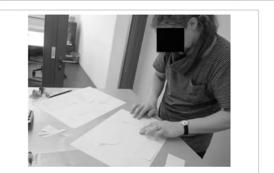 Figure 2-1 : A software engineer scribbling together a paper prototype 