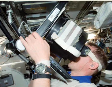 Figure 9: ESA astronaut Frank de Winne performing the 3D SPACE experiment, testing the differences in perception of dimensions and depth in between normal gravity on Earth and microgravity (Credit: ESA)