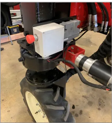 Figure 2.13: One of four red e-Stop buttons located on  exterior of machine for quick and safe access.