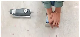 Fig. 2. Friction measurement by horizontal pull slipmeter.   