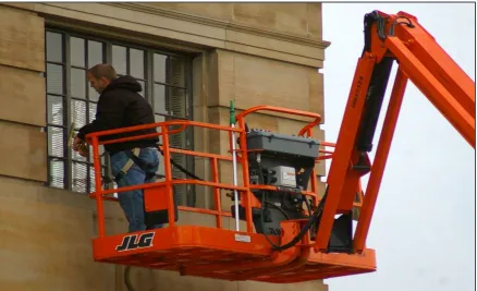 Figure 1.4:  Workers using crane for their job 