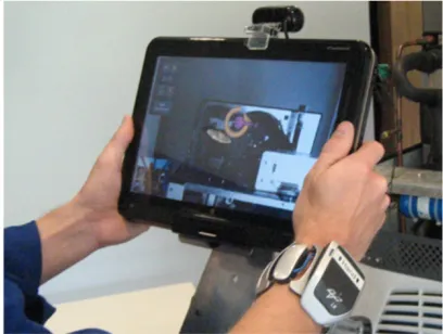 Figure 11. Interactive AR instructions on a large screen. A motor- bike engine on the bottom is captured by the user camera end pro-jected on the screen