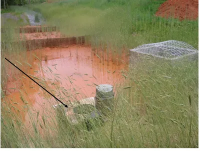 Figure 14.  15 inch culvert pipe exiting the basin and entering into a  level spreader