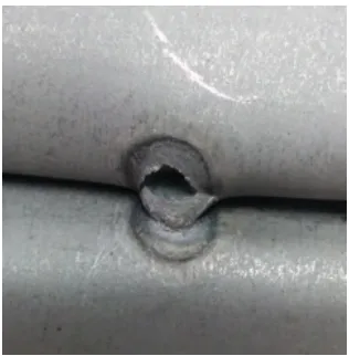 Figure 1.3 - An example of a peel test performed on a weld, the size of the welded 