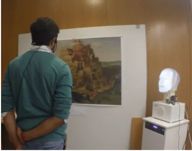 Figure 1: The scenario chosen as a test-bed for themodel: a robot presenting a painting to a human.