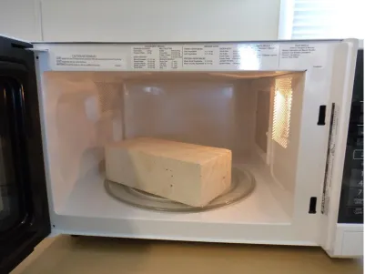 Figure 3.2: A refractory (fire) brick in the microwave oven for ‘no load’ protection 
