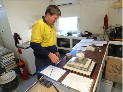 Figure 3.18: Weighing a microwave dried sub-sample between heating cycles 