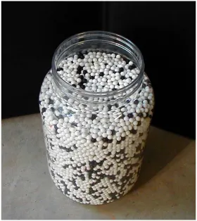 Figure 5.  Cellulose Acetate Plastic Spheres.  The black and white plastic spheres shown in the photograph were utilized in the physical experiments as the primary target material