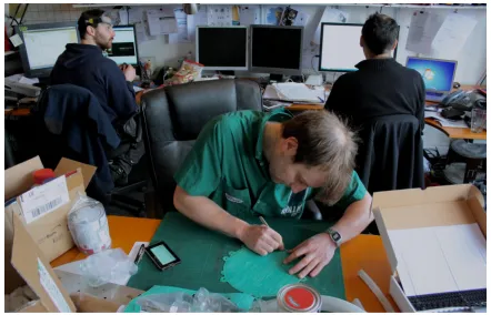 Figure 1: A typical working environment of a UK product design studio. In this case the practitioners are concurrently engaged in conversation, computation and making
