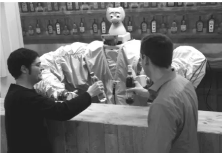 Figure 1: The robot bartender with two customers