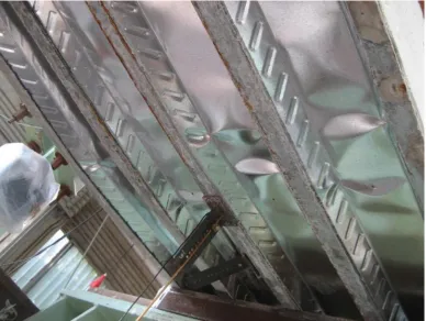 Figure 10. Buckling at the compression side of the steel sheet for tested specimen. 