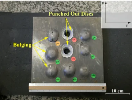 Figure 2.1: Backside of 1.5” (38 mm) plate of Al 2139 after V50 test showing bulging and disc punchout 