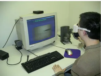 Figure 5.1. Sensable Technologies PHANTOM® Desktop™ haptic device integrated with the VR workstation and virtual surgical simulation