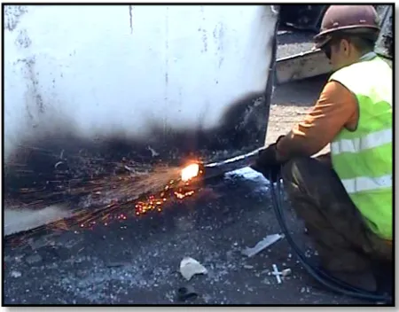 Figure 4: Worker cutting up a steel structure in the secondary cutting zone. 
