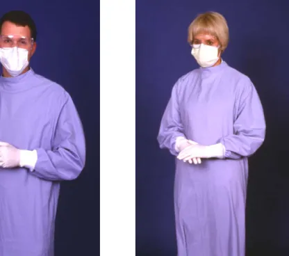 Figure 3-4  A properly attired student  using a moisture resistant gown,  surgical mask, protective eyewear, and  examination gloves