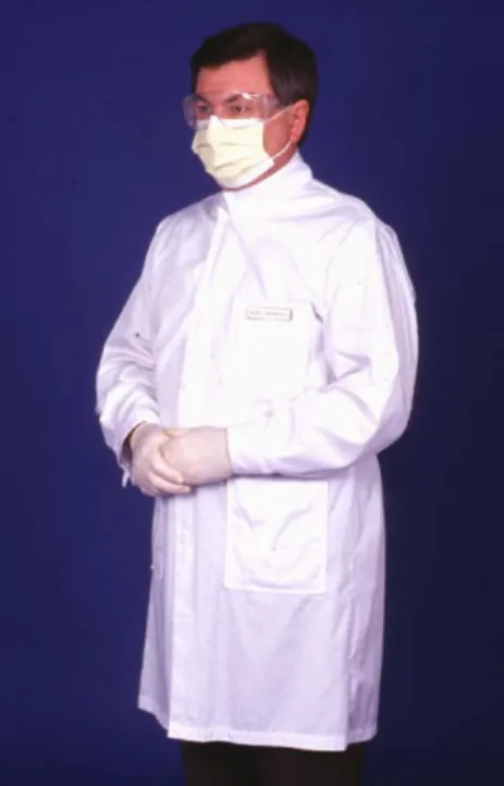 Figure 3-6  A properly attired faculty  member using a white gown with the  collar in the non-spatter position,  surgical mask, protective eyewear, and  examination gloves